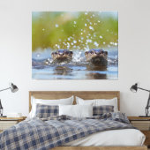 Speelse otters die opspringen uit het water met fo canvas afdruk (Insitu (Slaapkamer))
