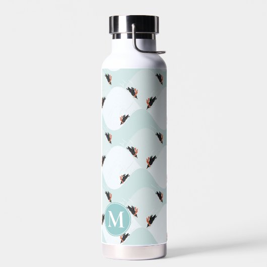 Speelse Pinguïns Glijden op Sneeuwpatroon Waterfles (Links)