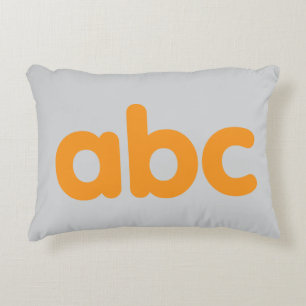Speelse primaire ABC kussen