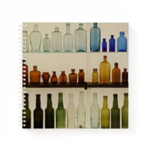 Spiraal notitieboek met glazen fles ontwerp