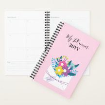 Spiral Planner met bloemen op roze achtergrond