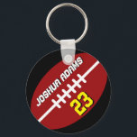 Sportteam Red Black Football Sleutelhanger<br><div class="desc">Een coole en kleurrijke sleutelhanger voor sportthema's als cadeau voor familie en vrienden. De Amerikaanse sleutelhanger van het football met gepersonaliseerd naam en speleraantal. Een geweldig souvenir voor football coach,  kapitein en spelers.</div>