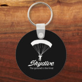 Spring met parachute de grond is de limiet sleutelhanger (Voorkant)