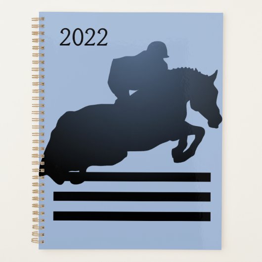 Springruiter die een hindernis neemt.  planner (Voorkant)