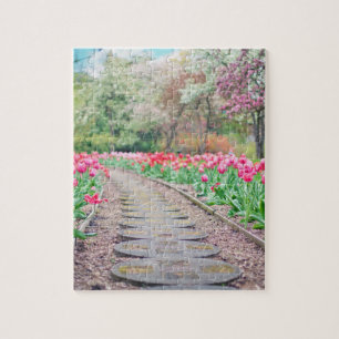 Springtime Flowers Along Stone Walkway Legpuzzel