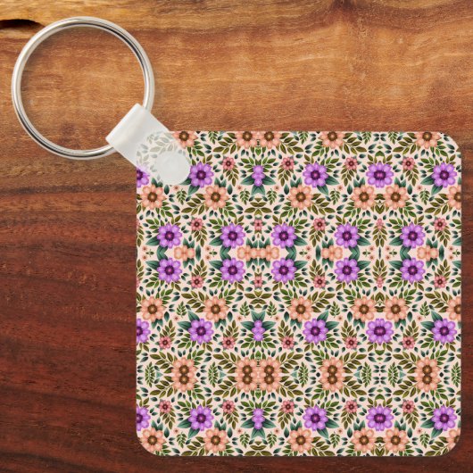 Square keychain showcasing a vibrant floral  (Voorkant)