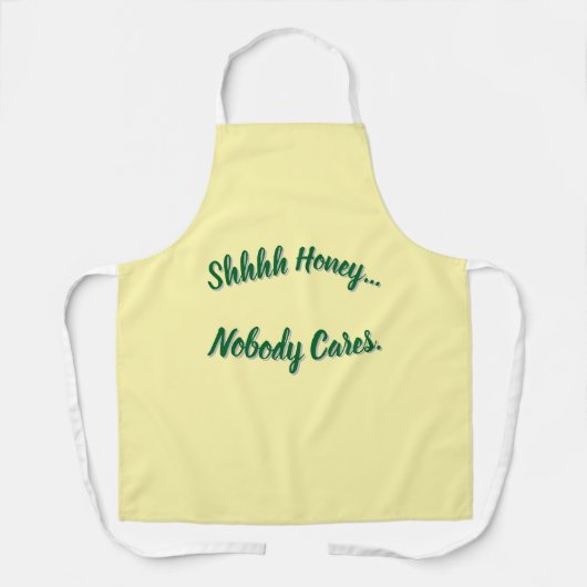 Ssst... Het kan niemand iets schelen. Schort (Voorkant)