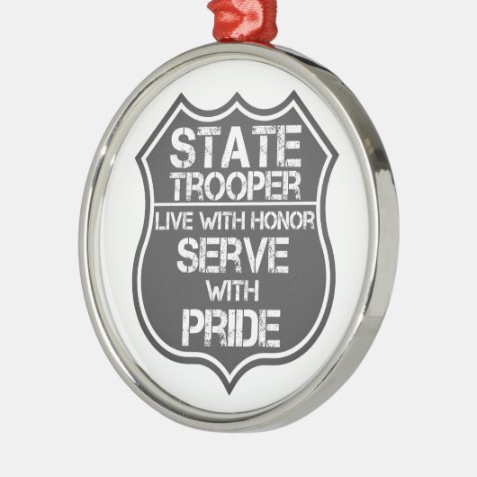 Staatstroepenmacht leeft met eer en serve met trot metalen ornament (Links)