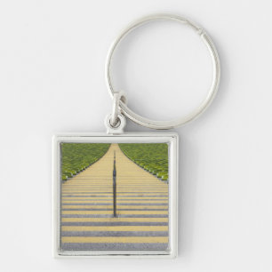 Stadiumtrap tussen rijen groene stoelen sleutelhanger