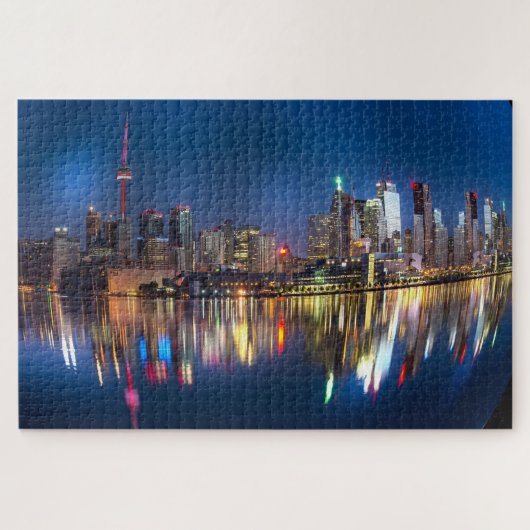 Stadsgezicht weerspiegeld in het meer legpuzzel (Horizontaal)