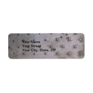 Stalen plaat metaal met rivetten die vuil zijn etiket