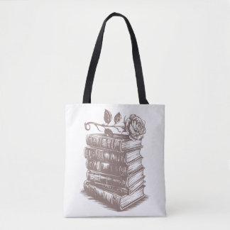 Stapel boeken bekroond met een roos tote bag