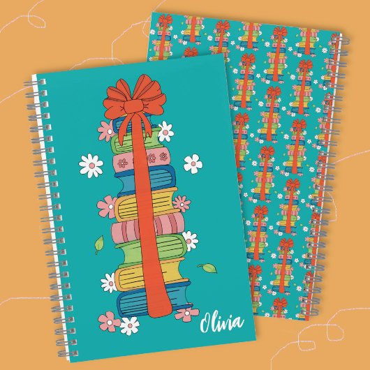 Stapel boeken met rode strik kind spiraal notebook