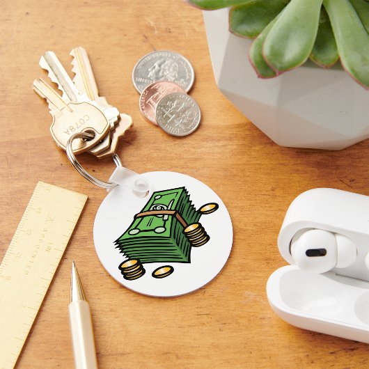 Stapel geld met munten geld sleutelhanger