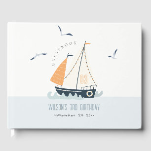 Stapel met blauwe zeilboot gastenboek