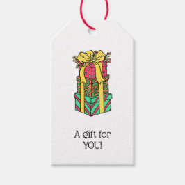 Stapelde gevlekte kerstcadeautjes cadeaulabel