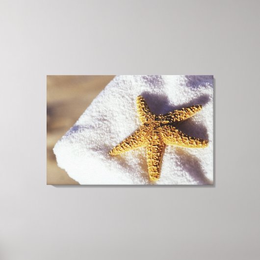 Starfish op een handdoek canvas afdruk (Voorkant)