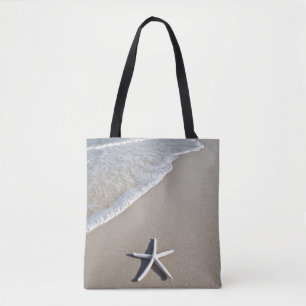 Starvis op een afstandsstrand tote bag