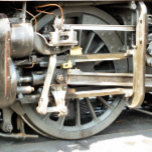 STEAM TRAINS CADEAUDOOSJE<br><div class="desc">Een foto van het wiel van een stoomtrein.</div>