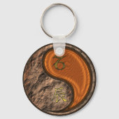 Steenbok en houten draak sleutelhanger (Achterkant)