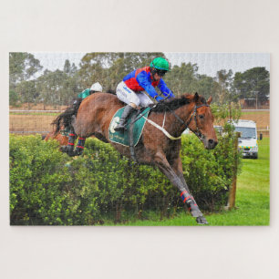 Steeplechase paard en rijder over de sprong legpuzzel