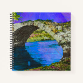 Stenen brug over rustig blauw water notitieboek