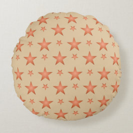 Sterpatroon in terracotta-oranje verlopend rond kussen