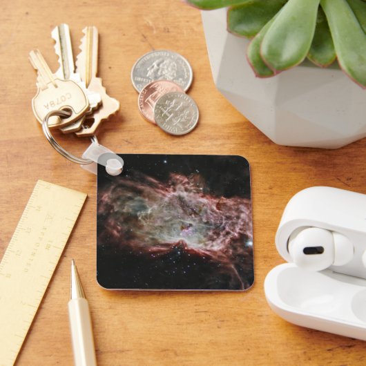 Sterrenhopen in het midden van de vlamnevel. sleutelhanger (Bureau)