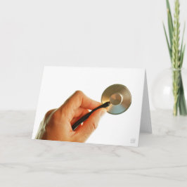Stethoscoop in een hand voor een ziekenhuis sfeer. bedankkaart