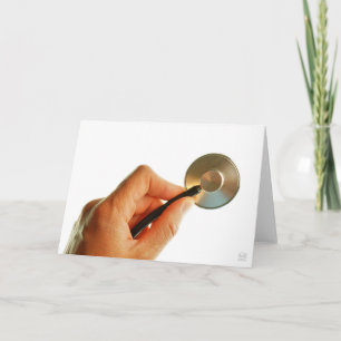 Stethoscoop in een hand voor een ziekenhuis sfeer. bedankkaart