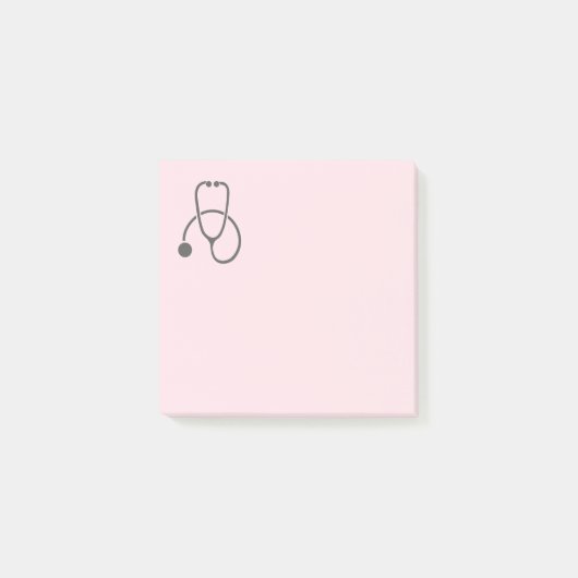 Stijlvolle grijze stethoscoop op pastroze post-it® notes (Voorkant)