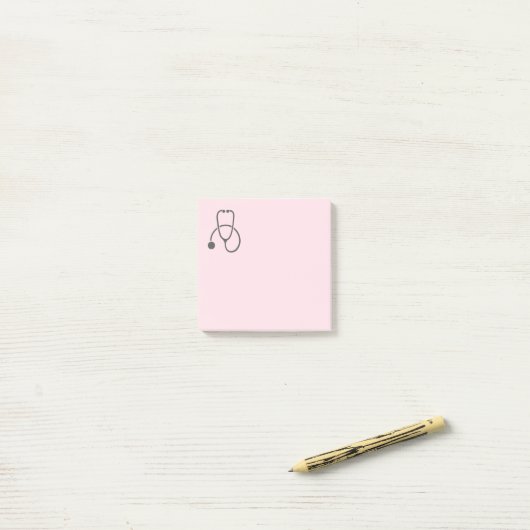 Stijlvolle grijze stethoscoop op pastroze post-it® notes (Op bureau)