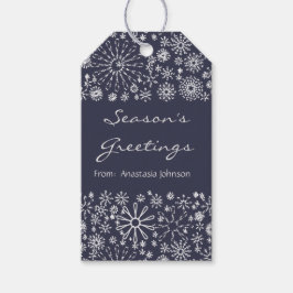 Stijlvolle koele feestelijke sneeuwvlok wervelt pa cadeaulabel