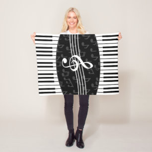 Stijlvolle muzieknoot en piano toetsen fleece deken