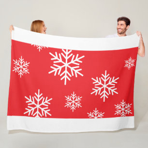 Stijlvolle pret sneeuwvlokken op heldere rood witt fleece deken