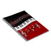 Stijlvolle rode zwarte witte pianotoetsen en notit notitieboek (Rechterzijde)