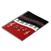 Stijlvolle rode zwarte witte pianotoetsen en notit notitieboek (Linkerzijde)