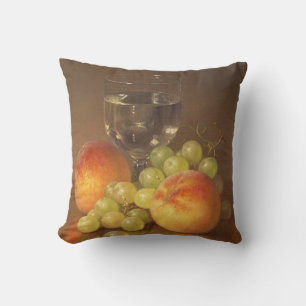 Stilleven, wijnglas, twee perziken, fruit en wijn kussen