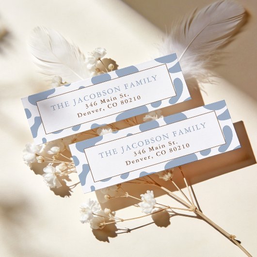 Stofblauw koeienprint retouradres etiket