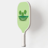 Stomme springerwten in de illustratie van de carto pickleball paddle (Links)