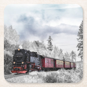 Stoomlocomotief trein reizen door de sneeuw kartonnen onderzetters