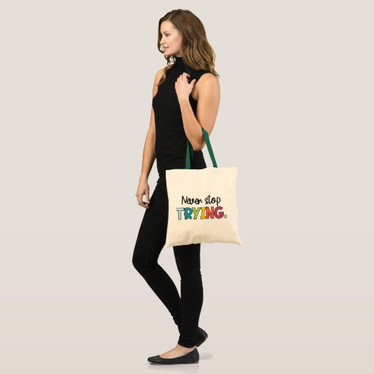 Stop nooit met proberen tote bag (Voorkant (model))