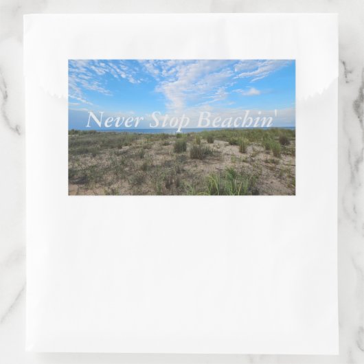 Stop nooit met Stickers aan het strand (Tas)