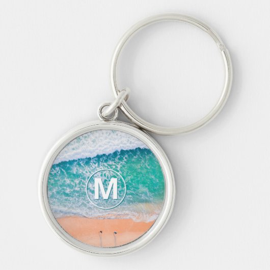 Strandgolven, wit monogram in cirkel sleutelhanger (Voorkant)