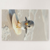 Strandloper leert surfen legpuzzel (Horizontaal)
