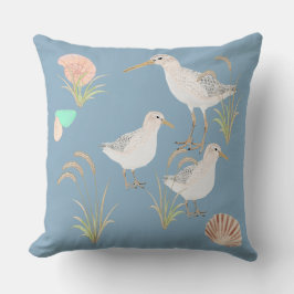 strandlopers op de kust van zeegras kussen