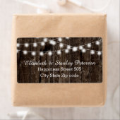 String van lichten op oude houten zomer bruiloft etiket (Insitu)