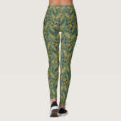 Stylized botanical orange and black floral pattern leggings (Achterkant)