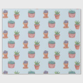 Succulte en cacti op blauw cadeautje tegen achterg cadeaupapier (Vlak)