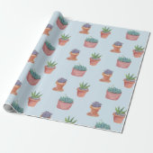 Succulte en cacti op blauw cadeautje tegen achterg cadeaupapier (Uitgerold)